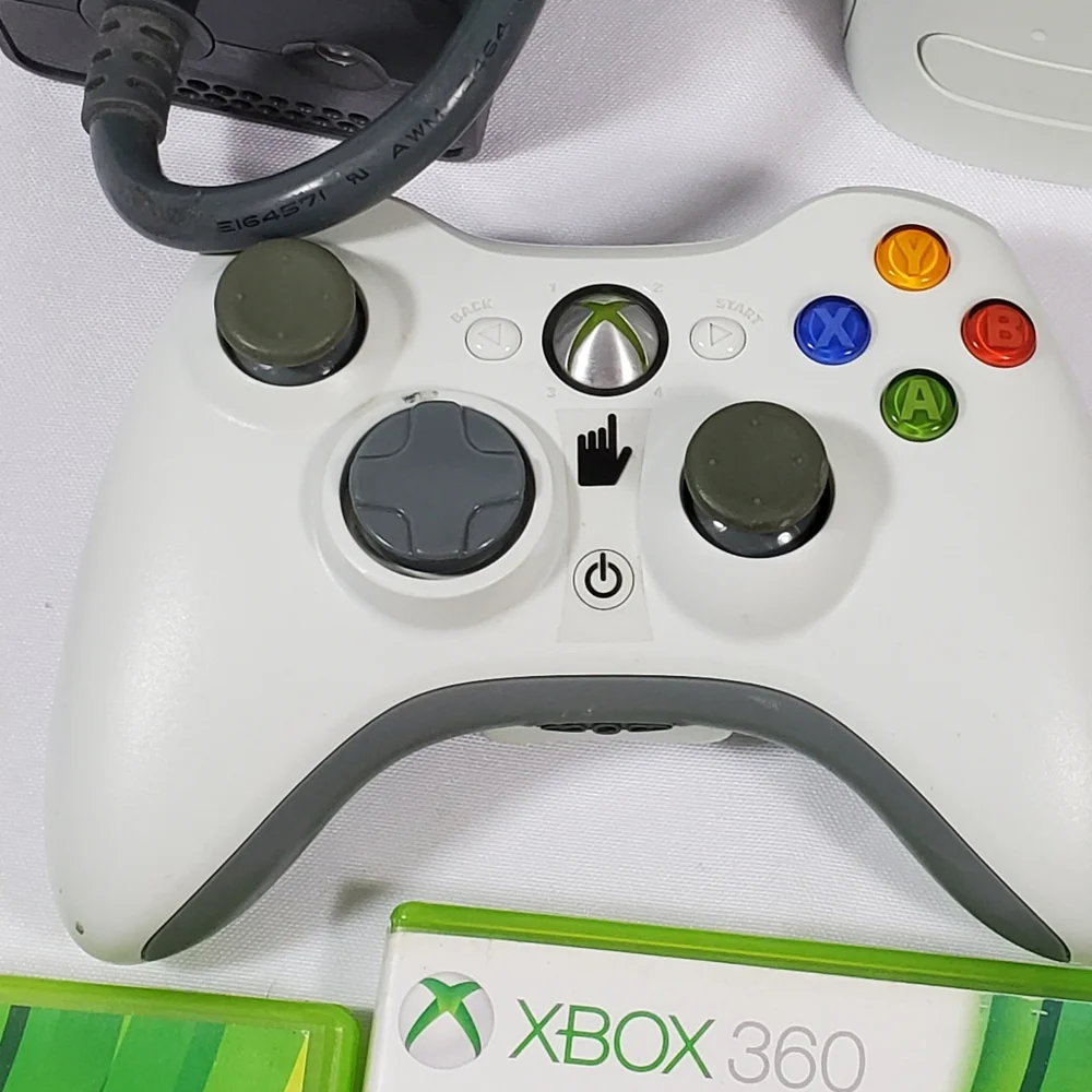 Xbox 360 with 4 games, 2 Controllers Tested Excellent.Condition is Excellent,